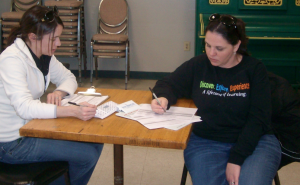 Laura Pleiman, Boone County Human Services Director, and Adriana Silva of Bulington, compare notes