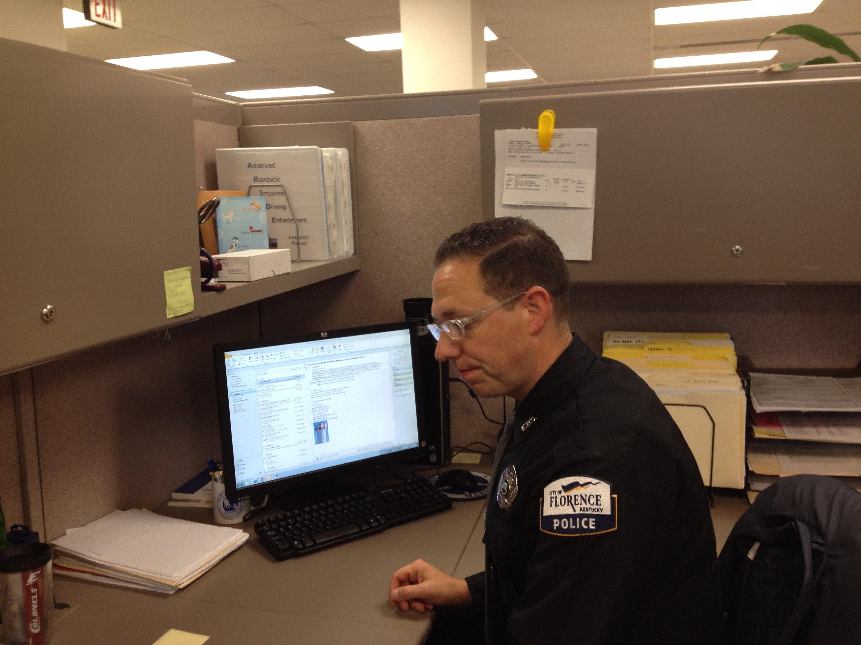 cop at desk