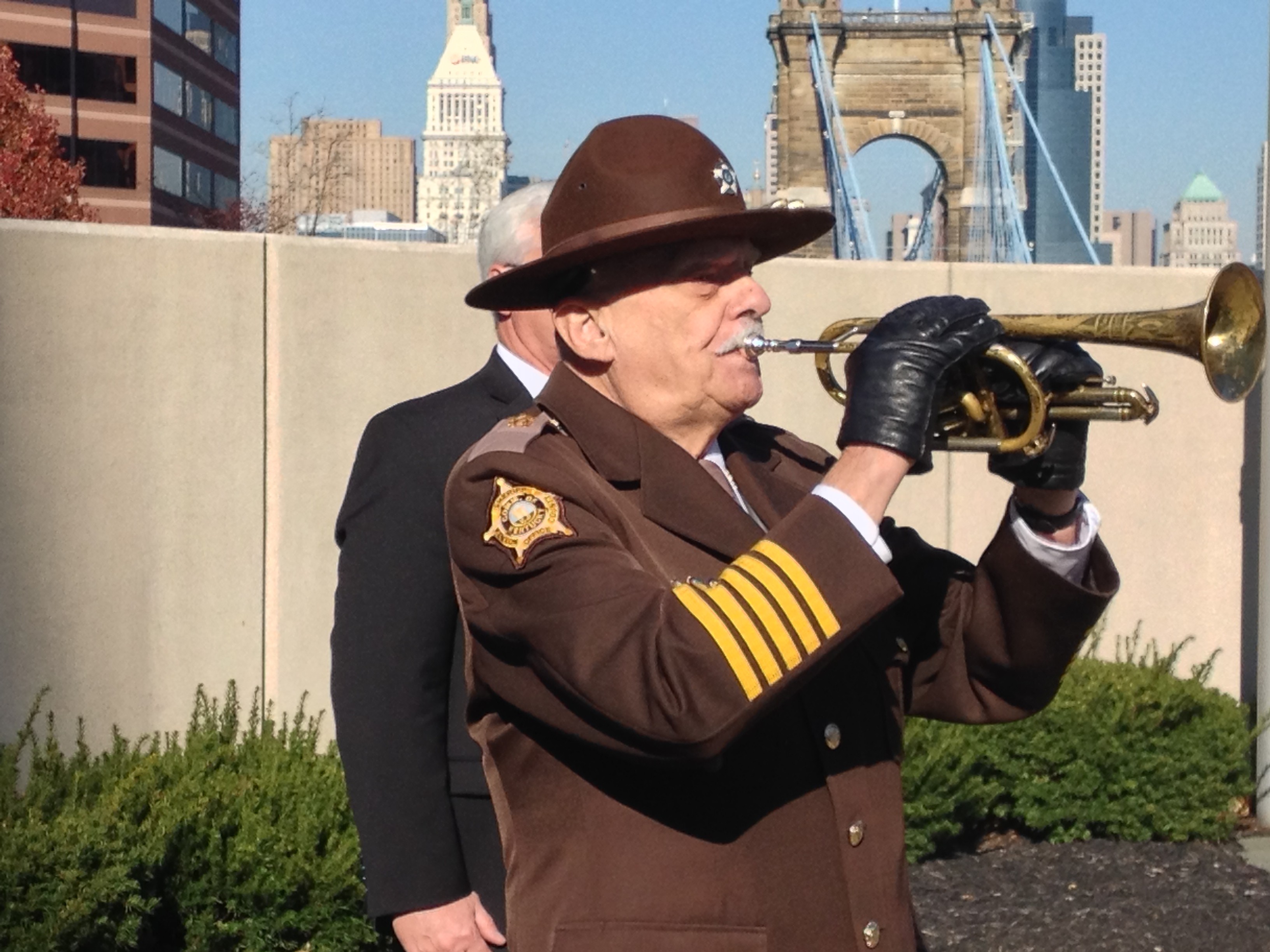 Kenton County Sheriff Chuck Korzenborn played Taps at the ceremony (photos by Mark Hansel).