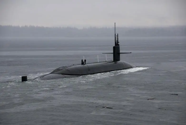 The Ohio-class ballistic-missile submarine USS Kentucky (SSBN 737) departs Naval Base Kitsap-Bangor for the boat's first strategic deterrent patrol since 2011. The boat recently completed a 40-month Engineered Refueling Overhaul, which will extend the life of the submarine for another 20 years. (U.S. Navy photo by Mass Communication Specialist 2nd Class Amanda R. Gray/Released)