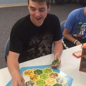 Simon Boschert prepares to play Catan