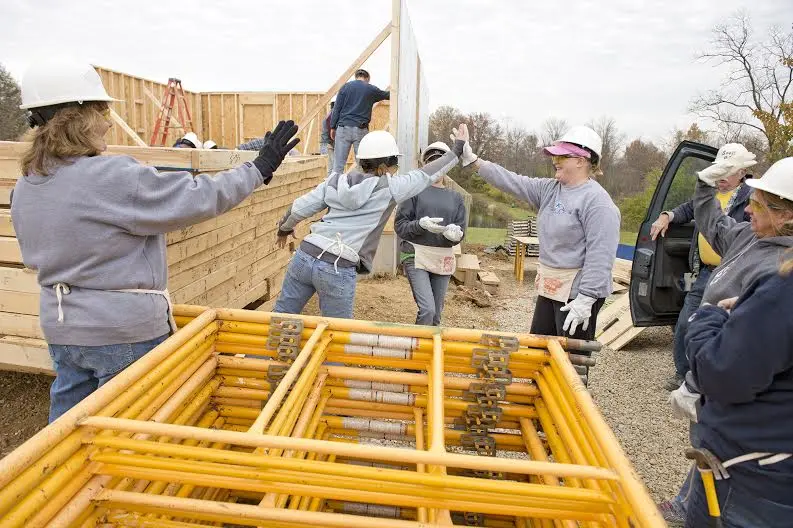 St. Elizabeth workers joined Habitat for Humanity to help build a home for the Chipps family in Covington. Photo: David Sorcher