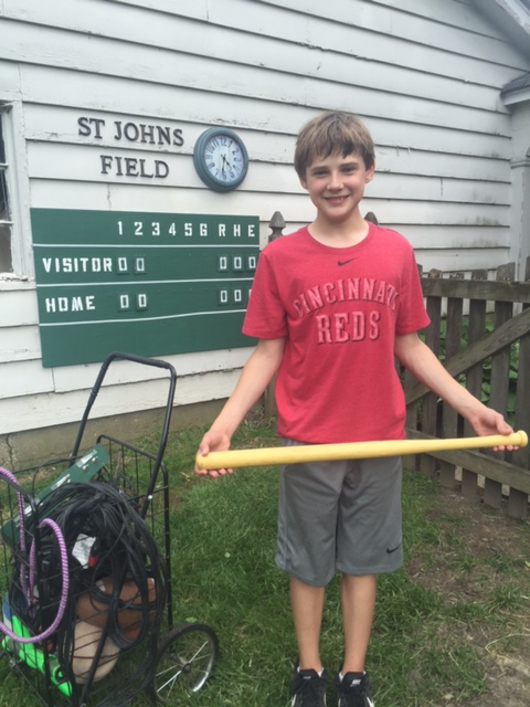Cole Hetzel with the Wiffle Ball bat his dad used as a child