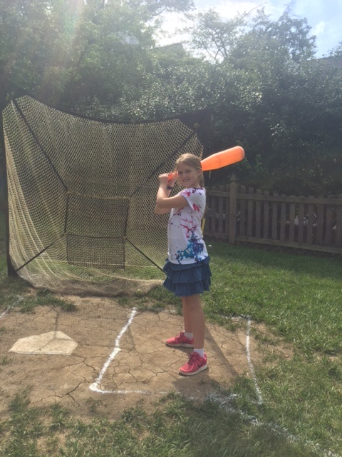 Emma Hetzel at bat on home plate