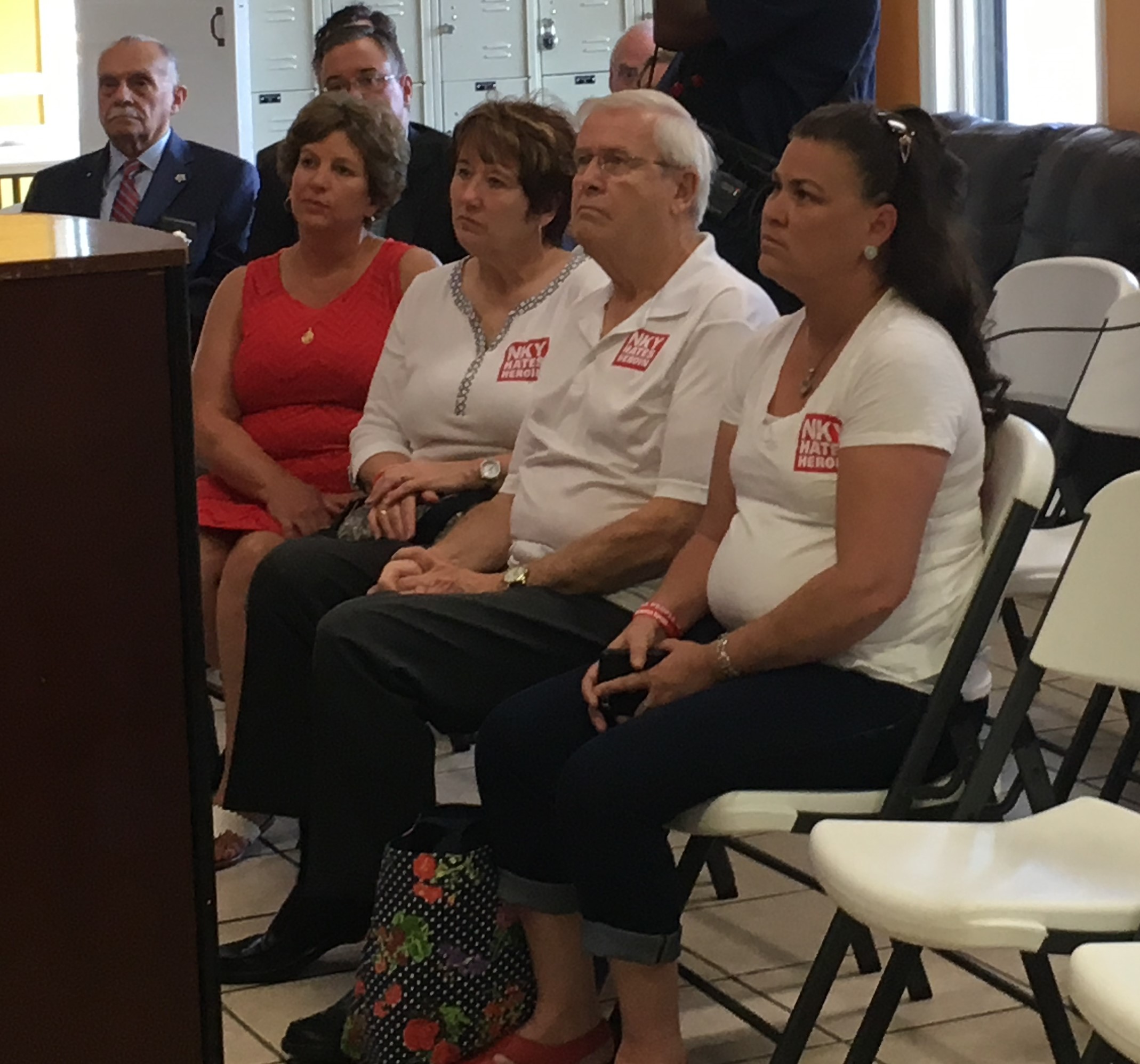 Members of NKY Hates Heroin, left to right, Joan Arlinghaus, Holly Specht, Noel Stegner and Kimberly Wright, listen to Attorney General Andy Beshear talk about the heroin epidemic at Transitions' WRAP House Wednesday.