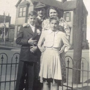 Front row Mary Lou Schroeder and her brother Gene Back Row Brother Richard Bussman and their mother Marie Bussman in Covington circa 1944