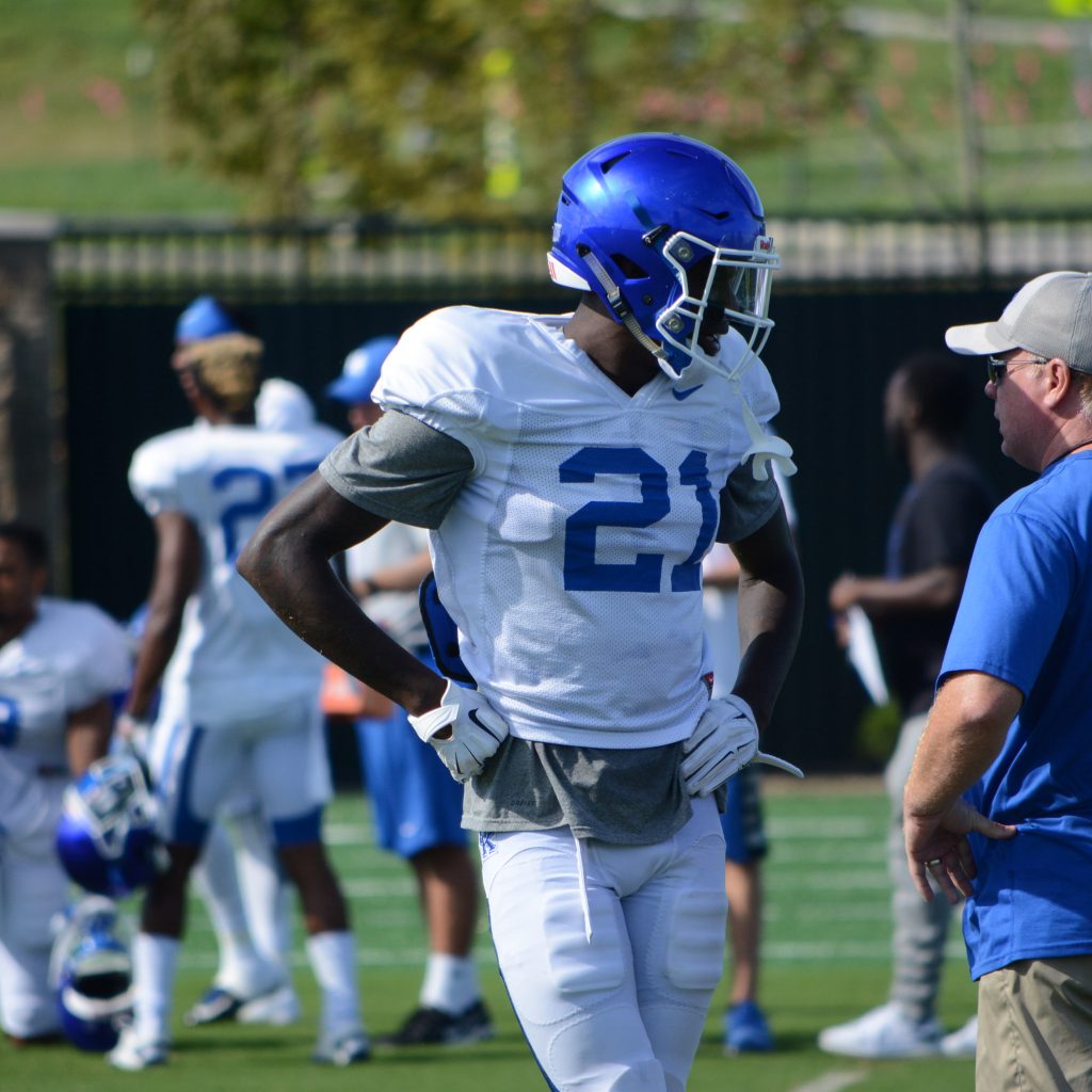 Kentucky coach Mark Stoops talks to defensive back Chris Westry during practice Monday (Keith Taylor Photo)