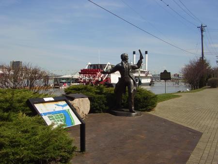 Some photos depict images of more recent history. This is an image from March 17, 2010 of the John Roebling statue on Covington's riverfront, was provided by the KY History Department Staff. The Mike Fink Restaurant (under renovation) in background