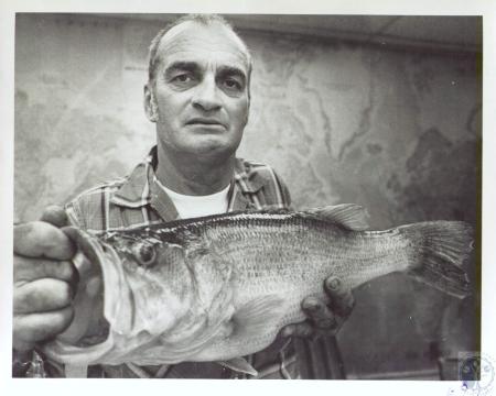 Eugene J. Chadle with 7 pound largemouth bass caught at A.J. Jolly Park. This Kentucky Post photo is dated April 13, 1977