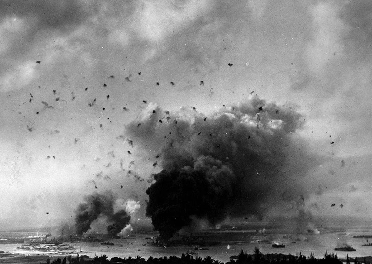 Japanese second wave of the attack flying into a hornet’s nest of fleet anti-aircraft fire. The large, black column of smoke in the center is the USS Arizona. (Library of Congress.) 