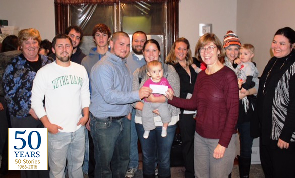 Members of the Rawe family with Brighton Center President Tammy