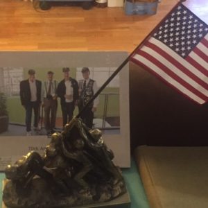 Treasured gifts. A  book from the Urology Group chronicles Switzer's trip to Washington DC, and a commemorative Iwo Jima bronze statue are treasured items.