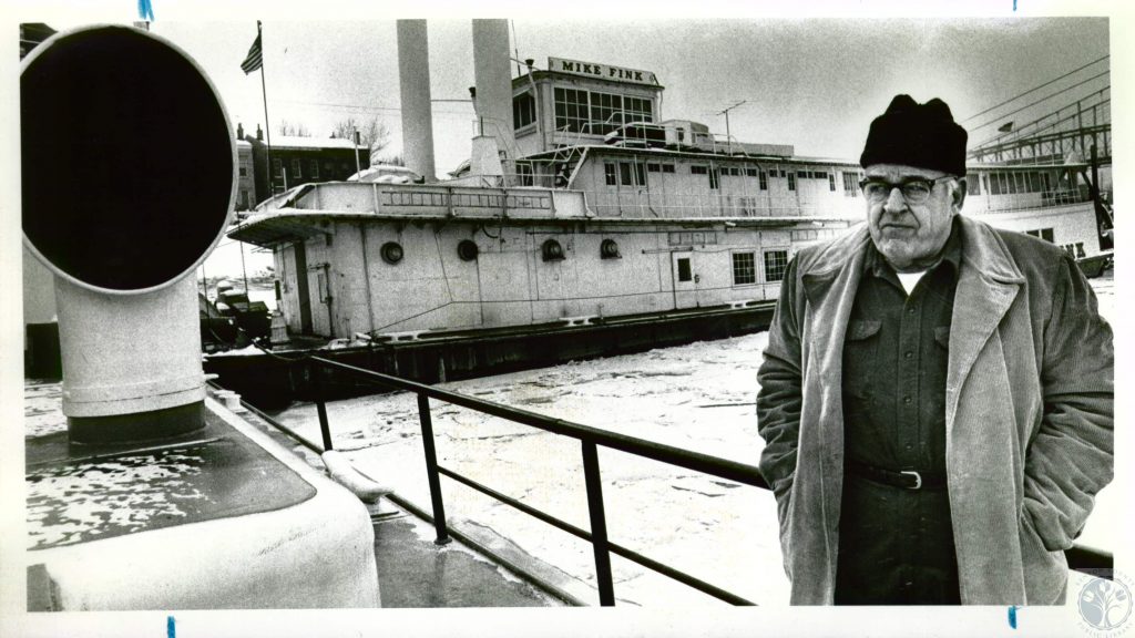 The River Needing job, he meets legendary Captain John Beatty . . .and