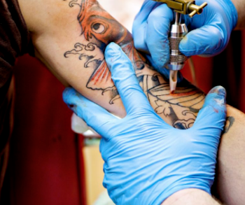 After comments, health cabinet removes proposal to ban tattoos on scarred skin in updated regulation