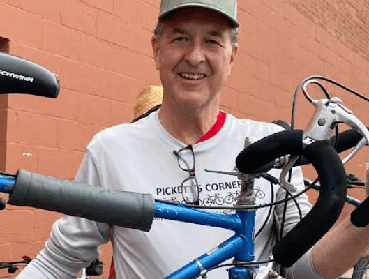 Alan Pickett works at his ‘bike ministry’ — free functional transportation for those in need